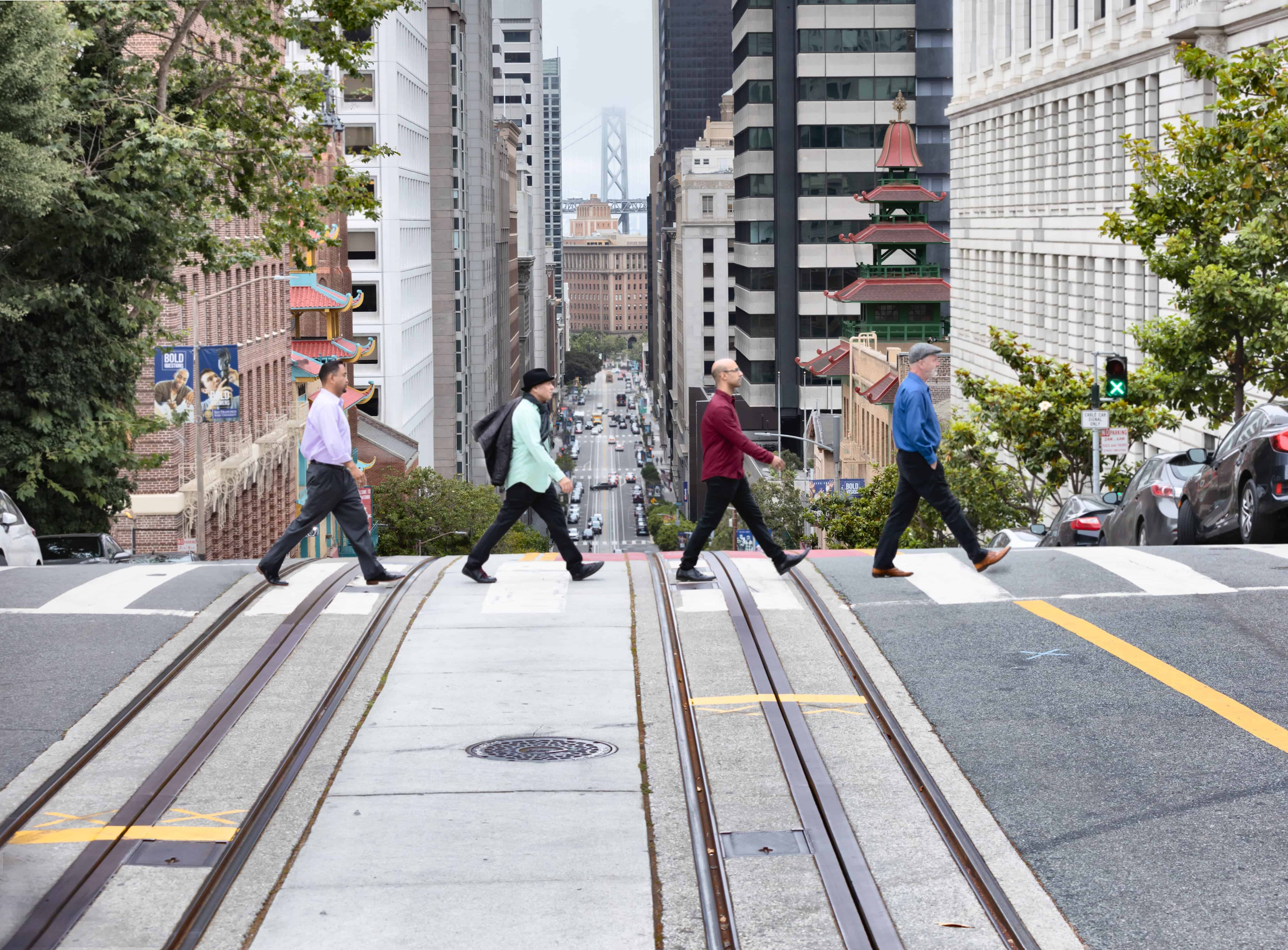 The Alexander String Quartet walking across a street in San Francisco - Abbey Road style on Crosswalk